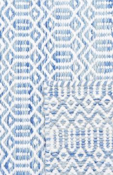 two different blue and white patterns on fabric