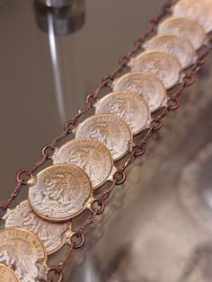 Mexican Coin Bracelet Mid Century 1950-1960, Tourist Souvenir Jewelry  These were made by soldering jump rings to the side of the coin and linking them with oval rings. Everything is soldered and in great shape.,, nice and strong... They were made for tourists between 1940 and 1960. - Bracelet is 8 inches long and 1 inches wide. Vintage Bronze Coin-shaped Jewelry, Vintage Coin Shaped Metal Jewelry, Vintage Etched Jewelry For Commemoration, Vintage Silver Coin Bracelets, Vintage Silver Coin Bracelet, Vintage Coin-shaped Engraved Bracelets, Vintage Stamped Coin Jewelry, Vintage Stamped Jewelry For Commemoration, Vintage Commemoration Jewelry