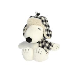 a white stuffed dog with a black and white checkered hat