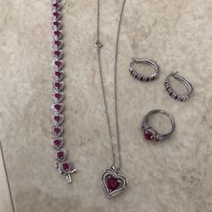 Diamond And Ruby, Heart Necklace, Heart Bracelet, Earrings, And Ring. I’m Not Sure If The Ruby’s Are Lab Created Or Not. All In Silver. All Items Were Given As A Gift And Purchased From A Mall Jeweler. Ruby Heart Necklace, Ruby Set, Ruby Heart, Necklace Heart, Heart Bracelet, Heart Necklace, Ruby, Lab, Women Jewelry