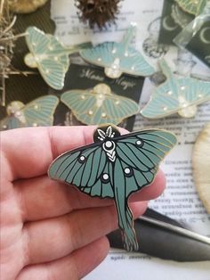 Luna moth enamel pin, subtle sage green and purple enamel with a polished silver finish. * Hard enamel Jewelry quality pin with a polished finish * 2 Post attachment with Butterfly OR Rubber Clutch. Unique Green Enamel Pin, Green Enamel Pin Brooch For Gift, Green Enamel Brooch Pin As Gift, Green Brooch Enamel Pin For Gift, Unique Green Enamel Pin Gift, Butterfly-shaped Enamel Pin Gift, Butterfly Shaped Enamel Pin For Gifts, Handmade Green Enamel Brooches, Green Enamel Brooch As Gift