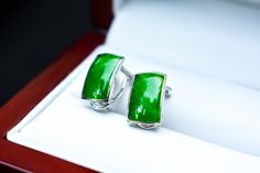 "Product Type: 18K White Gold Natural Green Jade Earrings  Main Stone: High Quality Natural \"Untreated\" Green Jadeite Jade Stone Carat Size: 3.2 Carats on Each Earring  Metal Purity: 18K White Gold  Style Type: Geometric   Length & Width Across: 15 mm x 13 mm Total Weight: 5 grams Category Type: Fine Jewelry  Condition: Fine Perfect Condition" Luxury Green Earrings With Polished Finish, Elegant Green Earrings With Polished Finish, Elegant Green Polished Earrings, Luxury Green Clip-on Earrings As Gift, Formal Green Jewelry With High Luster, Luxury Green Clip-on Earrings For Formal Occasions, Luxury Green Clip-on Jewelry, Formal Green High Luster Jewelry, Luxury Green Jade Earrings