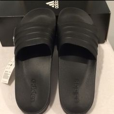 Adidas -Style Name: Adilette Shower -Description:. Unisex Slip-On Sandal/ Shower Slippers/Shoes -Color: Black/Black/Black -Size: Mens 13 /Women's 14 The Picture Has A Tag With A Tag With Size 11 On It, That Is Just Another Size That's Not This Pair. These Are Indeed 13 Mens And 14 Women's -Condition: New With Box Slip-resistant Black Sandals, Adidas Non-slip Black Slides, Adidas Black Non-slip Slides, Black Slip-resistant Sandals Made Of Tpr, Black Slip-resistant Sandals, Adidas Black Synthetic Sport Sandals, Black Slip-resistant Flat Sandals, Adidas Black Slip-on Slides, Comfortable Fade-resistant Black Sandals