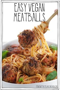 spaghetti with meatballs is being lifted by a fork from a white bowl that says easy vegan meatballs