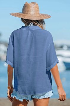 Complete your beach look with our Button Front Collared V-Neck Cover-Up Top. The button front and collared V-neck add a touch of classic charm, making it the perfect cover-up for a day by the water. Product code: CAA07A3B003UU Features:  Woven  V-neckline with collar Short sleeves Front buttons Loose fit Wash Method: Regular Wash Material: 65%RAYON,35%POLYESTER. Casual V-neck Blouse For Beach Season, Beachy V-neck Top For Day Out, Solid V-neck Beach Blouse, Solid V-neck Blouse For Beach, Solid V-neck Blouse For The Beach, Summer Collared Tops In Solid Color, V-neck Beach Top With Button Closure, Short Sleeve Solid Color Beach Tops, Solid Color Tops With Buttons For Beach Season