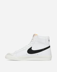 Nike WMNS Blazer Mid '77 Vintage Sneakers White / Black / Sail.One of Nike's historical models, which never goes out of trend. Conceived as a basketball shoe, it has evolved to become a lifestyle model to be worn every day, thanks to its ultra-soft high collar and the chance of wearing it anywhere..Leather Upper.Suede Overlays.Foam Tongue.Rubber Outsole.Style Code: CZ1055-100 Vintage Nike Custom Sneakers For Streetwear, Vintage Basketball Shoes With Rubber Sole For Streetwear, Throwback Mid-top High-top Sneakers With Gum Sole, Vintage Nike High-top Sneakers For Streetwear, Vintage Low-top Basketball Shoes With Gum Sole, Throwback High-top Sneakers With Gum Sole, White Throwback High-top Sneakers With Rubber Sole, White Throwback High-top Custom Sneakers, Retro Mid-top Basketball Shoes With Contrast Sole