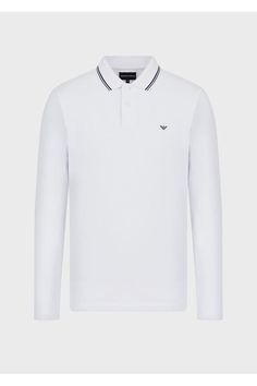 Long-sleeved polo shirt in a fresh, draped piqué fabric that adds understated elegance to the item. Embroidered micro eagle on the chest and contrasting striped inserts on the collar. This item belongs to the Essentials clothing selection, the Emporio Armani capsule collection that is an evergreen statement of style: an ongoing collection with clean, well-designed shapes for a wardrobe that meets the demands of any season. These essential, versatile pieces are a must-have for the male wardrobe. Men In White, Eagle Embroidery, Essentials Clothing, Emporio Armani Men, White Polo Shirt, White Polo, Pique Polo Shirt, Long Sleeve Polo Shirt, Clothing Essentials