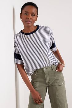 Elevate your everyday tee collection with this striped top from Sundry, featuring a crew neckline, color-blocked short sleeves, and a relaxed fit. Pair with cargo pants and a sandal for a put-together look. | SUNDRY Women's Stripe Blocked T-Shirt, Size Large, White Casual Crew Neck T-shirt With Striped Sleeves, Casual Striped Sleeve Crew Neck T-shirt, Casual Cotton T-shirt With Striped Sleeves, Casual Short Sleeve Tops With Striped Hem, Sporty Tops With Striped Hem And Relaxed Fit, Sporty Relaxed Fit Top With Striped Hem, Casual Tops With Striped Hem For Everyday, Casual T-shirt With Contrast Stripes, Relaxed Fit, Casual T-shirt With Striped Hem And Crew Neck