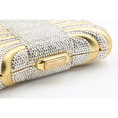 Elegant Judith Leiber minaudière looks like a gift box or pillow with a Swarovski crystal ribbon.  The bag features a press crystal lock closure with  golden hardware, The shoulder strap that can be tucked into the interior of the bag for use as a clutch. The interior is done in metallic leather.  It comes with a Leiber gold comb and mirror as well as a Leiber pouch. Crystal Box, Judith Leiber, Evening Clutch, White Crystal, Metallic Leather, Swarovski Crystal, Evening Bags, Comb, Swarovski Crystals