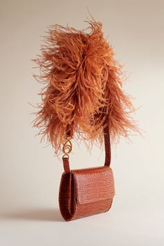 The Lijadu Bird Bag, now in Cognac Croc. The Cognac Croc comes with both a Candy Floss strap and a Cognac Croc strap. Wear as an over-the-shoulder, or remove the strap to wear as a clutch. You do you. Approximate dimensions: 8 inches x 7 inches; 23 inch strap; 2.5 inches wide Luxury Brown Flap Bag With Adjustable Strap, Evening Rectangular Cognac Flap Bag, Luxury Brown Clutch Evening Bag, Evening Cognac Shoulder Bag With Removable Pouch, Luxury Brown Flap Bag For Evening, Luxury Brown Flap Bag For Evening Events, Luxury Brown Evening Bag With Detachable Handle, Elegant Evening Shoulder Bag With Long Strap, Cognac Shoulder Bag For Evening