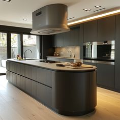 a large kitchen with an island in the middle