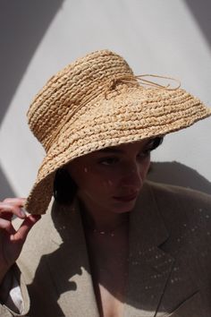 Vintage stunning straw hat with wide brim and tie accent. Favorite classic that can be worn at the beach or around town :) Can be styled with gold toned jewelry and favorite market dresses or over swim. Material not listed, assuming raffia Tag reads Kaminski Australia - Handmade in Madagascar Measures approximately: 22.5" circumference / 5" brim Some light wear to the inner head band - does not affect the overall look or wear. If you would like additional info or images prior to final sale purch Gold Straw Hat With Curved Brim For Vacation, Gold Curved Brim Straw Hat For Vacation, Elegant Gold Sun Hat For Vacation, Gold Wide Brim Straw Hat, Gold Short Brim Panama Hat For Summer, Gold Curved Brim Straw Hat For Summer, Gold Straw Hat For Summer, Gold Panama Hat With Curved Brim For Beach, Gold Straw Hat For Beach With Short Brim