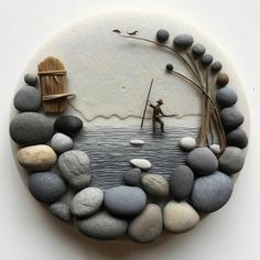 a stone sculpture depicting a man fishing in the water with rocks and grass around it