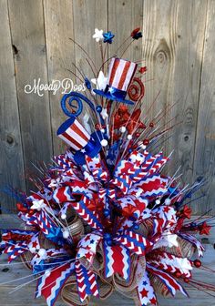 a patriotic wreath with red, white and blue decorations