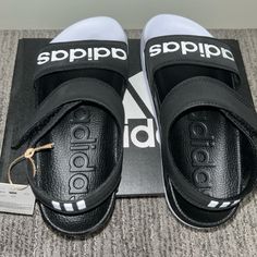 Adidas Black/White Sandals Women’s Size 6 Nwt Summer Black Adidas Sandals, Adidas Black Sport Sandals For Summer, Black Adidas Logo Sandals, Adidas Sandals With Logo, Synthetic Material, Black Adidas Sandals For Summer, Adidas Open Toe Sandals With Logo, Adidas White Sport Sandals, White Adidas Sport Sandals, Spring Adidas Logo Open Toe Sandals