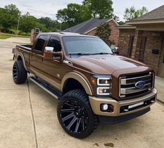 a brown truck parked in front of a house