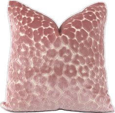 a pink pillow with white spots on it