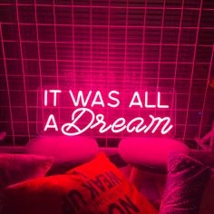 it was all a dream neon sign with pillows