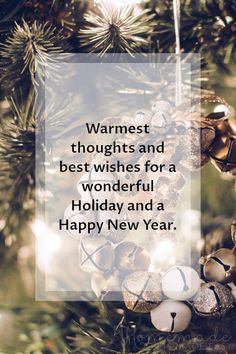 a christmas ornament hanging from a tree with the words warmest thoughts and best wishes for a wonderful holiday and a happy new year