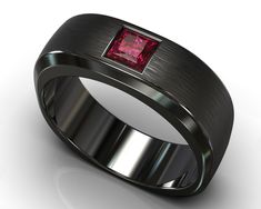 "Classy, clean, elegant yet unique. Nobody said a minimalist look should entail basic colors and forgettable designs, we managed to preserve the refined style while also making it one-of-a-kind by taking an amazing vivid red ruby and setting it flush in a rounded-square ring of black gold with varying texture, sheer and sleek on the interior and sides, and a brushed gold texture on the face of the band to contrast beautifully with the polish of the gemstone. PAYMENT PLAN- Click Here To Find The Modern Red Jewelry For Wedding, Modern Ruby Wedding Ring, Modern Red Ruby Ring For Wedding, Modern Red Ruby Wedding Ring, Modern Red Wedding Rings, Minimalist Red Rings For Formal Occasions, Ruby Mens Wedding Band, Mens Sapphire Wedding Band, Mens Wedding Band Black