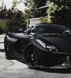 a black sports car parked on the street