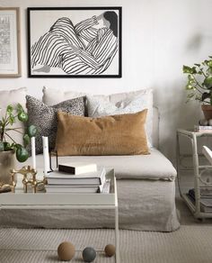 a living room filled with lots of furniture and decor on top of a white table