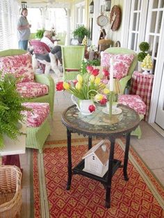 a living room filled with furniture and flowers