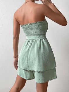 Show off your style in this Trim Shirred Belted Tube Romper. This romper features a strapless neckline, sleeveless design, and high-waisted fit for an ultra-flattering look. The mint green color is complemented by the contrast lace, frill, and shirred details for added charm. It is crafted from lightweight woven fabric with a slight stretch that allows you to move comfortably at all times. Plus, it comes with a matching belt to add definition to your waistline. Perfect for any special event or party, this romper will make sure you look stylish yet feel comfortable all night long! Features: Color: Mint Green Pattern Type: Plain Details: Belted, Contrast Lace, Frill, Shirred Length: Short Type: Tube Fit Type: Regular Fit Neckline: Strapless Sleeve Length: Sleeveless Waist Line: High Waist Fa Green Strapless Tube Top For Day Out, Strapless Green Tube Top For Day Out, Solid Sleeveless Tube Top For Day Out, Solid Color Sleeveless Tube Top For Day Out, Casual Bandeau Jumpsuits And Rompers For Spring, Green Sleeveless Tube Top For Day Out, Green Tube Top For Day Out, Green Strapless Tube Top For Spring, Strapless Jumpsuits And Rompers For Spring And Summer