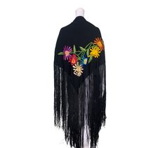 This is a colourful embroidered shawl of European manufacture dating from the mid-Twentieth Century. A wearable size, it would be ideal for any special occasion. As pictured, the embroidery is in single corner, and the remainder of the shawl is sheer black. Measurements Embroidered panel - 106cm by 115cm Condition  Very good, with the odd tiny hole and mark. For more antique clothing, come and visit us in the shop: Oliver Vintage, Portobello Green Arcade, 281 Portobello Road, London, W10 5TZ. One Size Folk Embroidered Shawl, Embroidered Folk Shawl One Size, One Size Embroidered Folk Shawl, Traditional Spring Shawl, Traditional Embroidered One-size Shawl, Traditional Embroidered One Size Shawl, Vintage Embroidered Shawl For Spring, Folk Shawl With Embroidered Border, Traditional Embroidered Shawl For Spring