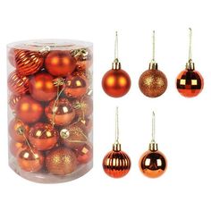 an assortment of shiny christmas ornaments in a clear container with gold and red baubles