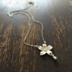 This necklace handcrafted by Jewelry By Carmal is made of sterling silver: flower charm, chain, spring ring clasp closure and findings. This necklace measures 17 2/3 inches in length and the flower charm measures a little larger than 1/2 inch in length. View other chain necklaces: http://www.etsy.com/shop/jewelrybycarmal?section_id=8001511 We offer free standard shipping within the United States. Our jewelry is unique and custom designed. We would love to assist you with any custom orders or nee