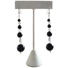 1920s pierced black dangling earrings. Made from smooth, round, Persian black Onyx beads and faceted crystal roundels. Strung on a fine sterling silver chain. The original wires have been replaced with modern sterling silver fittings. See the matching necklace we have listed. 65 x 13 mm widest bead.  Love it ♡  Get it ☆  Get Lucky 💋 Vintage Classic Onyx Jewelry For Party, Black Crystal Chandelier Earrings, Black Czech Glass Jewelry With Round Beads, Evening Black Bead Drop Earrings, Elegant Black Bead Drop Earrings, Elegant Faceted Round Bead Crystal Earrings, Elegant Black Beaded Crystal Jewelry, Black Beaded Long Drop Jewelry, Elegant Black Beaded Chandelier Earrings