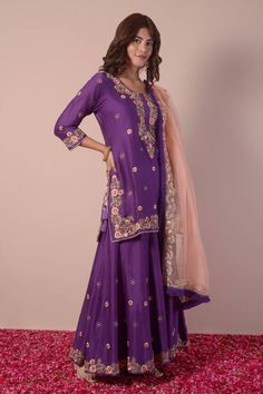 Purple kurta with gota patti, thread, sequin hand embroidery in floral butti pattern all over. Paired with sharara and contrast peach dupatta with embroidered border. - Aza Fashions Semi-stitched Purple Sharara With Resham Embroidery, Chanderi Palazzo Set With Resham Embroidery For Diwali, Designer Resham Embroidery Sharara For Diwali, Eid Dola Silk Sharara With Dabka Work, Designer Raw Silk Sharara With Gota Work, Designer Wear Dola Silk Sharara With Zari Work, Transitional Raw Silk Sharara With Zari Work, Diwali Raw Silk Palazzo Set With Zari Work, Bollywood Style Chinon Sharara With Zari Work