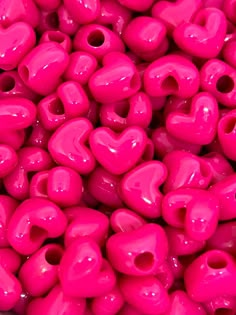 pink heart shaped beads with holes in the middle