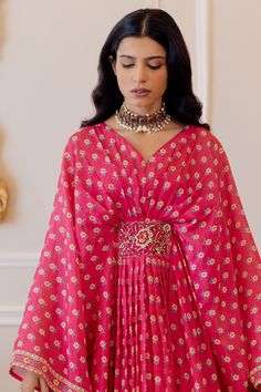 Hot pink kaftan with floral printed motifs, front-pleated and placement floral embroidery. Paired with satin inner.
Component: 2
Printed
Neckline: V neck
Sleeve Length: Full
Fabric: Kaftan: Cotton Silk, Inner: Satin
Color: Pink
Satin inner
Floral motifs
Flared sleeves - Aza Fashions Elegant V-neck Floral Print Kurta, Bollywood Style Dresses With Cape Sleeves For Eid, Elegant Georgette Sets With Floral Print, Bollywood Dress With Cape Sleeves For Festivals, Pink Dabka Gown For Reception, Pink Gown With Dabka For Reception, Pink Reception Gown With Dabka Embroidery, Traditional V-neck Dresses For Reception, Pink Cape Sleeves Dress With Sheer Dupatta