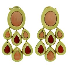 These fabulous Van Cleef & Arpels Girandole clip-on dangle earrings are crafted in 18k yellow gold and set with oval and drop-shaped angel skin corals and with oxblood corals. Made in France circa 1995. Measurements: 0.98" (25mm) width, 1.49" (38mm) length. Excellent condition. Comes with original pouch. Van Cleef & Arpels, Angel Skin, Van Cleef And Arpels, Van Cleef Arpels, Van Cleef, Made In France, Clip On Earrings, Jewelry Earrings Dangle, Dangle Earrings