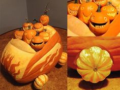 pumpkins with faces carved into them sitting in a bowl on top of a table