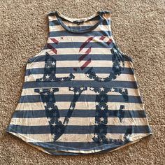 This Ransom Tank Top Is Size Medium. This Is Brand New But The Tags Were Removed. It Would Be Perfect For The 4th Of July. Casual American Flag Print Top For Vacation, American Flag Print Cotton Top For Beach, Spring Casual Tank Top With American Flag Print, Casual American Flag Print Tank Top For Spring, Patriotic Sleeveless Tops For Spring, Trendy Sleeveless Top For 4th Of July, Casual Tops For 4th Of July Vacation, Casual Tops For 4th Of July Beach Outing, Casual Tops For Vacation And 4th Of July