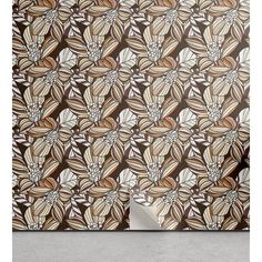 a brown and white wallpaper with flowers on it