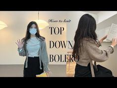 two women wearing masks in front of a sign that says top down bolero