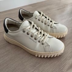 Salvatore Ferragamo Cube 2 Leather Sneakers - Off-White Dark Silver Sleek And Timeless Women’s Sneakers That Go With Everything! Dress Them Up Or Down With Trousers And A Cute Too, Or Shorts And Summer Dresses. Highest Quality Leather That Won't Scuff Easily. Gently Used - Very Minor Creasing And Wear On Laces As Pictured Size 6.5 C Women’s True To Size. Salvatore Ferragamo Shoes, Ferragamo Shoes, Picture Sizes, High Quality Leather, Leather Sneakers, Salvatore Ferragamo, Womens Shoes Sneakers, Silver Color, Shoes Sneakers