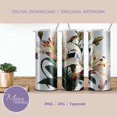 three metal canisters with flowers painted on them, next to a succulent plant