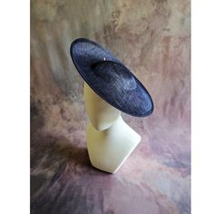 "One contoured saucer with a slight upturned brim hat sinamay straw fascinator / hat base in navy blue that measures approximately 13\" in diameter. The base is contoured to fit against the head. The edges of the brim are finished in sinamay. The multi-layer stiffened sinamay straw has a great sturdy weave and provides excellent support for your millinery creations. This is NOT a finished ready to wear hat and it will not stay on your head unless you add a head band to wear. Add embellishments of your choice. A nice high quality base - I know you'll be pleased! This hat base is listed separately in red, royal blue, gray, fuchsia, baby blue, ivory, rose pink, green, and black. Check my listings for those options... Lots of hat bases and millinery supplies listed in my shop   www.etsy.com/sh