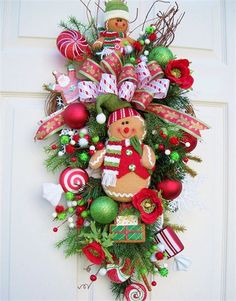 a christmas wreath with gingerbreads and other decorations