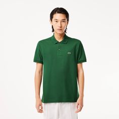 The Original L.12.12 is the very first polo shirt invented by René Lacoste in 1933. With its collar, button placket and Petit Piqué, it revolutionized elegant sportswear and freedom of movement. Made using 20 kilometres of thread knitted under two levels of tension and a crocodile logo with 2367 stitches, the Original L.12.12 is a real coming together of know-how and expertise. René Lacoste, Lacoste Polo, Lacoste Men, Cotton Polo, Swim Suit Bottoms, Mother Of Pearl Buttons, Sweaters And Jeans, Mens Polo Shirts, Sweater And Shorts