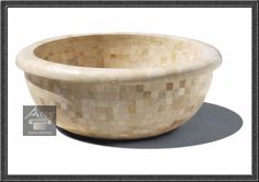 a bowl made out of mother of pearl with a black border around the edge and bottom