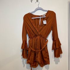 Copper Colored Romper With Wrap Around Belt Nwt Long Sleeve Jumpsuit With Tie Waist For Day Out, Chic Jumpsuits And Rompers For Fall Brunch, V-neck Jumpsuits And Rompers For Fall Brunch, Fall Brunch V-neck Jumpsuits And Rompers, Casual Jumpsuits And Rompers For Going Out In Fall, Casual Fall Brunch Jumpsuits And Rompers, Brown Long Sleeve Jumpsuits For Night Out, Casual Fall Jumpsuits And Rompers For Date Night, Casual Jumpsuits And Rompers For Date Night In Fall