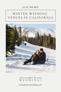 a couple sitting in the snow on their wedding day