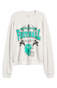 Score a touchdown in this crewneck sweatshirt featuring a sporty graphic and relaxed fit. 25 1/2" length (size Small/Medium) Crewneck Ribbed cuffs and hem 68% polyester, 29% rayon, 3% spandex Machine wash, dry flat Imported Relaxed Fit Screen Print Sweatshirt For Game Day, Varsity Style Crew Neck Sweats With Graphic Print, College Football Season Graphic Print Sweatshirt, Throwback Logo Print Sweatshirt For Fall, Oversized Sweatshirt With Ribbed Cuffs For Game Day, Fall Throwback Logo Print Sweatshirt, Team Spirit Sweatshirt With Ribbed Cuffs, Varsity Sweatshirt For Football Season Streetwear, Game Day Sweatshirt With Graphic Print For Sports Season