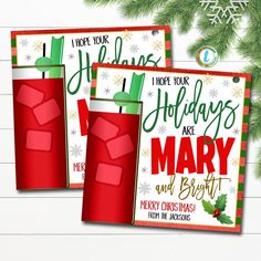 two holiday greeting cards with red drinks